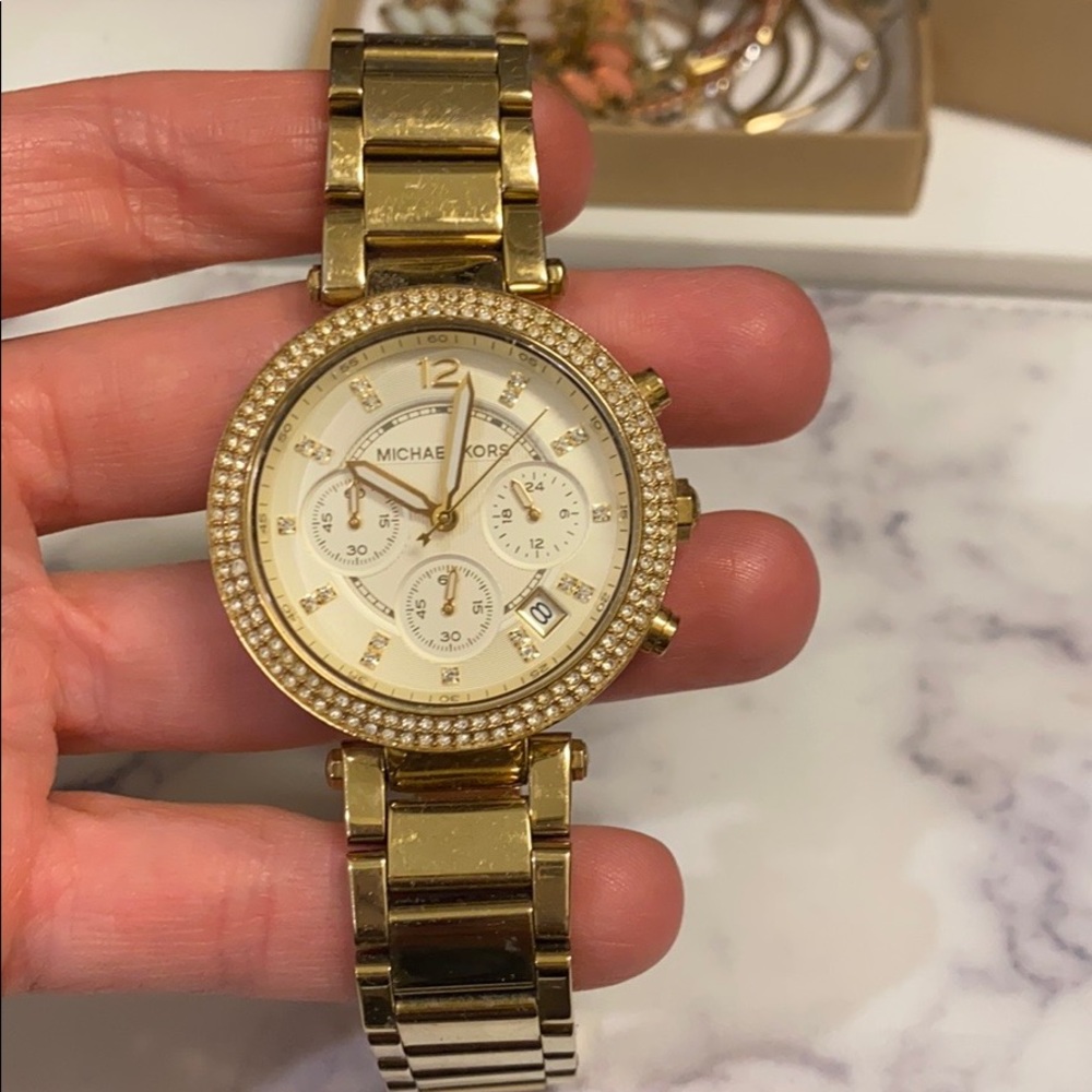 Gold Michael Kors watch with diamond bezel